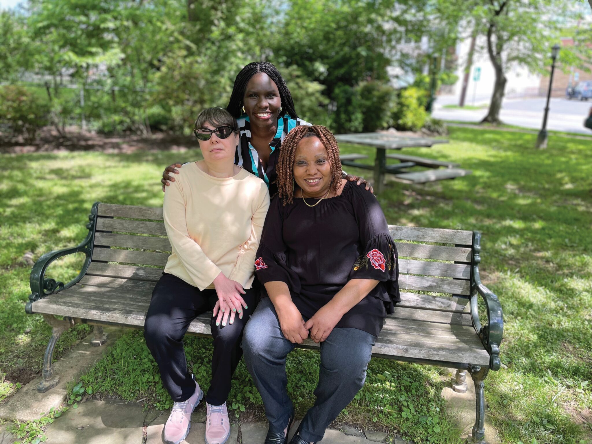 photo of Kirstin, Georgina and Michaelis on park bench