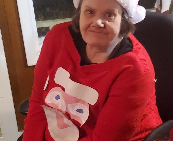 Kate Whitmore participates in the ugly sweater contest