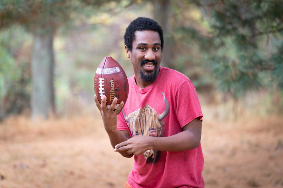Khalil Gholson holding a football