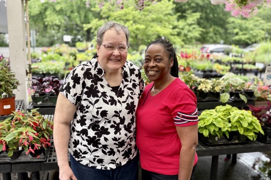 Donna Zimmerlin and Muriel Menzene (left to right) enjoy a day out in Kensington. They stand with their arms around each other at Johnson's Garden Center admiring the flowers for sale.